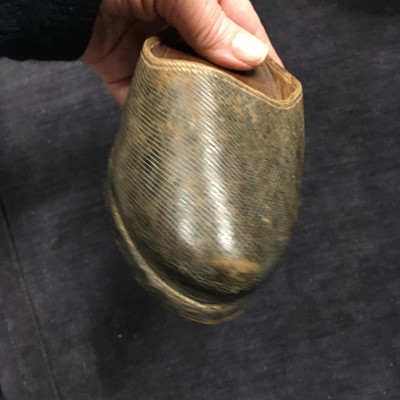 Lot 423 - A pair of black satin shoes and a pair of unusual brown leather pattens, 1770-1780