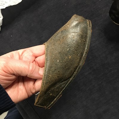 Lot 423 - A pair of black satin shoes and a pair of unusual brown leather pattens, 1770-1780