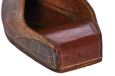 Lot 423 - A pair of black satin shoes and a pair of unusual brown leather pattens, 1770-1780
