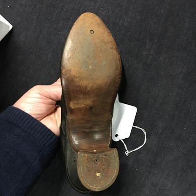 Lot 423 - A pair of black satin shoes and a pair of unusual brown leather pattens, 1770-1780