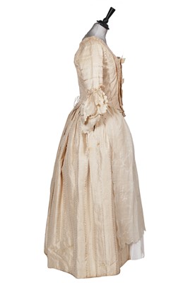 Lot 424 - An ivory striped silk robe a l'Anglaise, 1773
