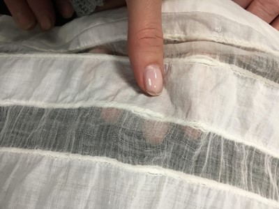 Lot 110 - A white percale cotton gown, English, circa 1815