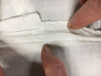 Lot 110 - A white percale cotton gown, English, circa 1815