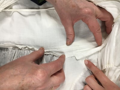 Lot 110 - A white percale cotton gown, English, circa 1815
