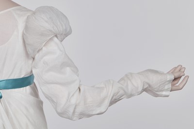 Lot 110 - A white percale cotton gown, English, circa 1815