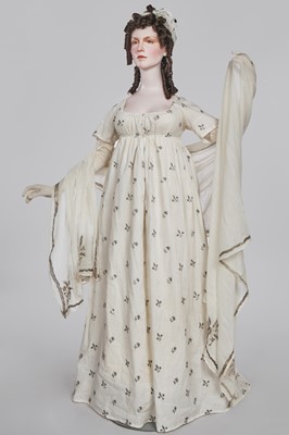 Lot 33 - A white cotton gown with silver Indian embroidery with pointed train, German, 1803-1805