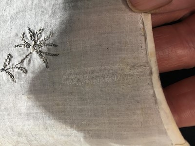 Lot 33 - A white cotton gown with silver Indian embroidery with pointed train, German, 1803-1805