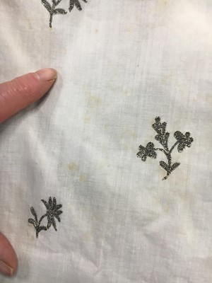 Lot 33 - A white cotton gown with silver Indian embroidery with pointed train, German, 1803-1805