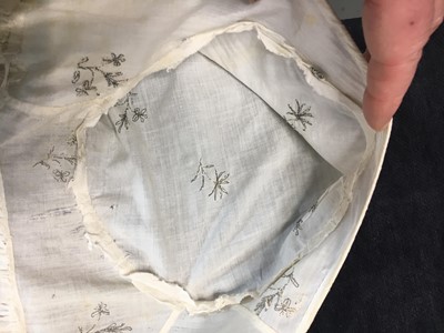 Lot 33 - A white cotton gown with silver Indian embroidery with pointed train, German, 1803-1805