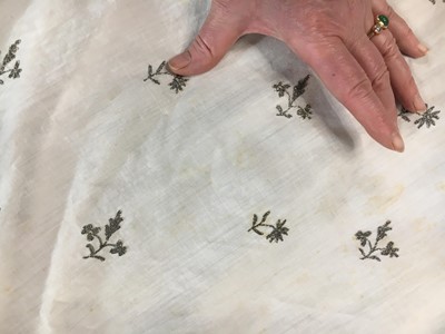 Lot 33 - A white cotton gown with silver Indian embroidery with pointed train, German, 1803-1805