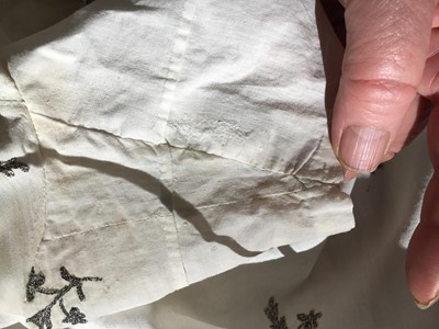 Lot 33 - A white cotton gown with silver Indian embroidery with pointed train, German, 1803-1805