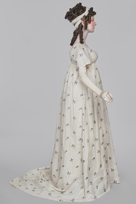 Lot 33 - A white cotton gown with silver Indian embroidery with pointed train, German, 1803-1805