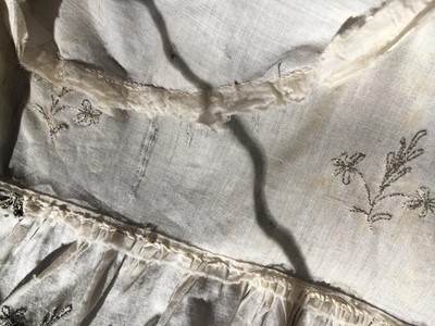 Lot 33 - A white cotton gown with silver Indian embroidery with pointed train, German, 1803-1805