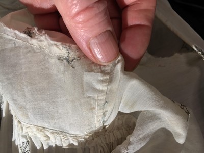 Lot 33 - A white cotton gown with silver Indian embroidery with pointed train, German, 1803-1805