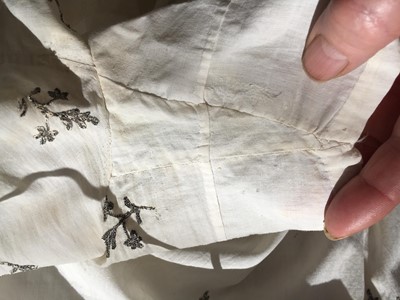 Lot 33 - A white cotton gown with silver Indian embroidery with pointed train, German, 1803-1805