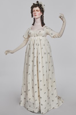 Lot 33 - A white cotton gown with silver Indian embroidery with pointed train, German, 1803-1805