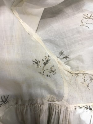 Lot 33 - A white cotton gown with silver Indian embroidery with pointed train, German, 1803-1805