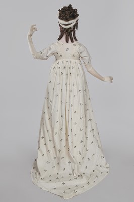 Lot 33 - A white cotton gown with silver Indian embroidery with pointed train, German, 1803-1805