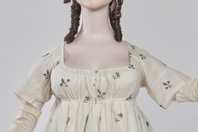 Lot 33 - A white cotton gown with silver Indian embroidery with pointed train, German, 1803-1805