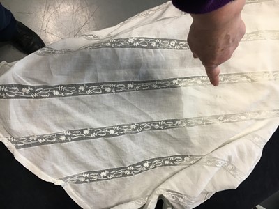 Lot 4 - A white linen and lace gown with long train American, circa 1798-1800
