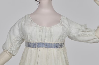 Lot 4 - A white linen and lace gown with long train American, circa 1798-1800