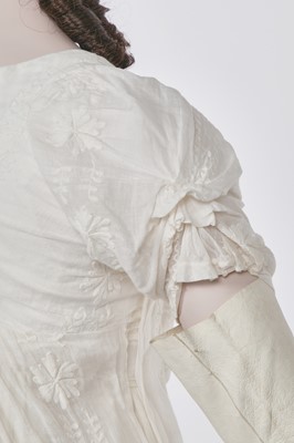 Lot 31 - A whitework embroidered muslin gown with long train, French, circa 1800