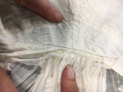 Lot 31 - A whitework embroidered muslin gown with long train, French, circa 1800