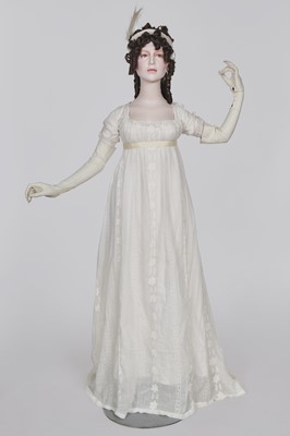 Lot 31 - A whitework embroidered muslin gown with long train, French, circa 1800