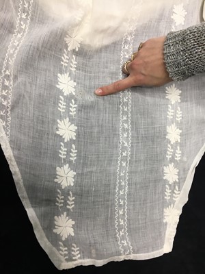 Lot 31 - A whitework embroidered muslin gown with long train, French, circa 1800