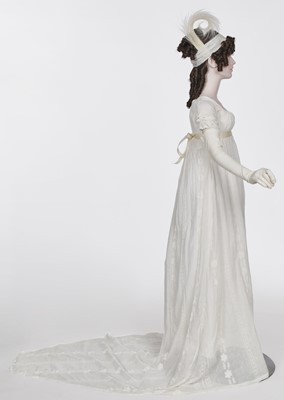 Lot 31 - A whitework embroidered muslin gown with long train, French, circa 1800