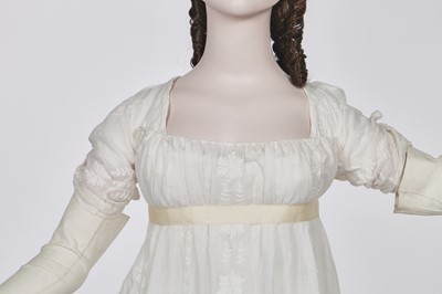 Lot 31 - A whitework embroidered muslin gown with long train, French, circa 1800
