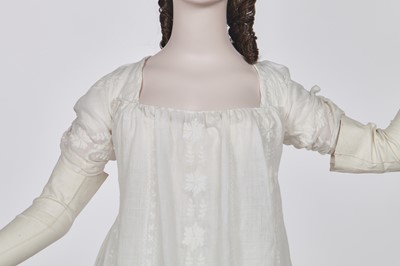 Lot 31 - A whitework embroidered muslin gown with long train, French, circa 1800