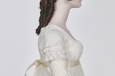 Lot 31 - A whitework embroidered muslin gown with long train, French, circa 1800