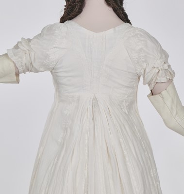 Lot 31 - A whitework embroidered muslin gown with long train, French, circa 1800