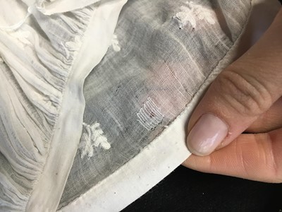 Lot 105 - A white cotton spencer, circa 1815