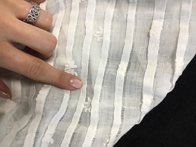 Lot 105 - A white cotton spencer, circa 1815