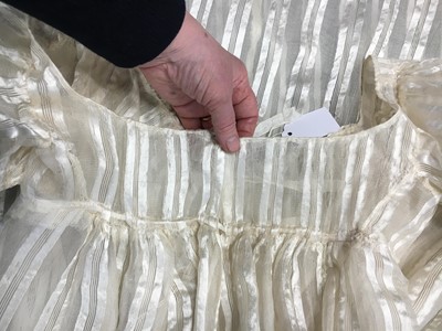 Lot 89 - An ivory striped silk gauze ball gown, English, circa 1812