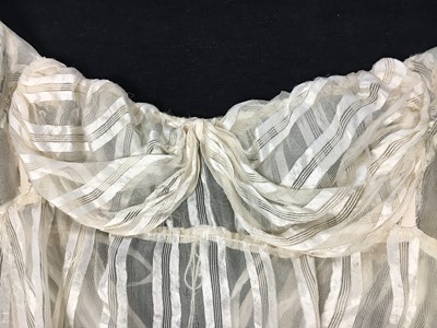 Lot 89 - An ivory striped silk gauze ball gown, English, circa 1812