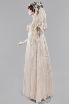 Lot 89 - An ivory striped silk gauze ball gown, English, circa 1812