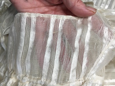 Lot 89 - An ivory striped silk gauze ball gown, English, circa 1812