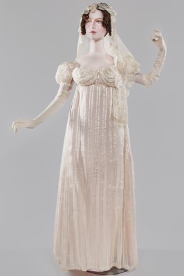 Lot 89 - An ivory striped silk gauze ball gown, English, circa 1812