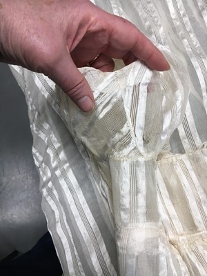 Lot 89 - An ivory striped silk gauze ball gown, English, circa 1812
