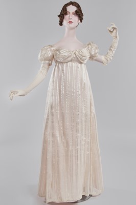 Lot 89 - An ivory striped silk gauze ball gown, English, circa 1812