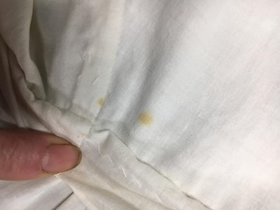 Lot 57 - A white percale redingote, French, 1808-12