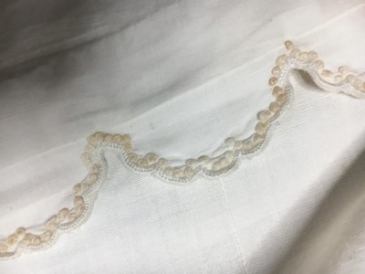 Lot 57 - A white percale redingote, French, 1808-12