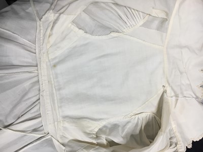 Lot 57 - A white percale redingote, French, 1808-12
