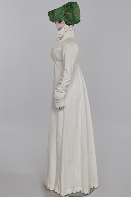 Lot 57 - A white percale redingote, French, 1808-12