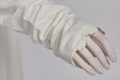 Lot 57 - A white percale redingote, French, 1808-12
