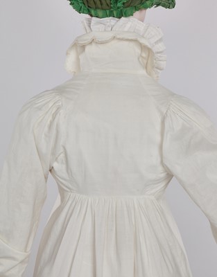 Lot 57 - A white percale redingote, French, 1808-12