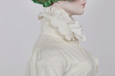 Lot 57 - A white percale redingote, French, 1808-12